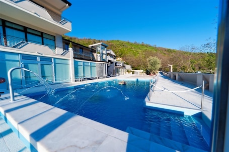 Seasonal outdoor pool, open 9:00 AM to 7:00 PM, pool umbrellas. Vea Resort