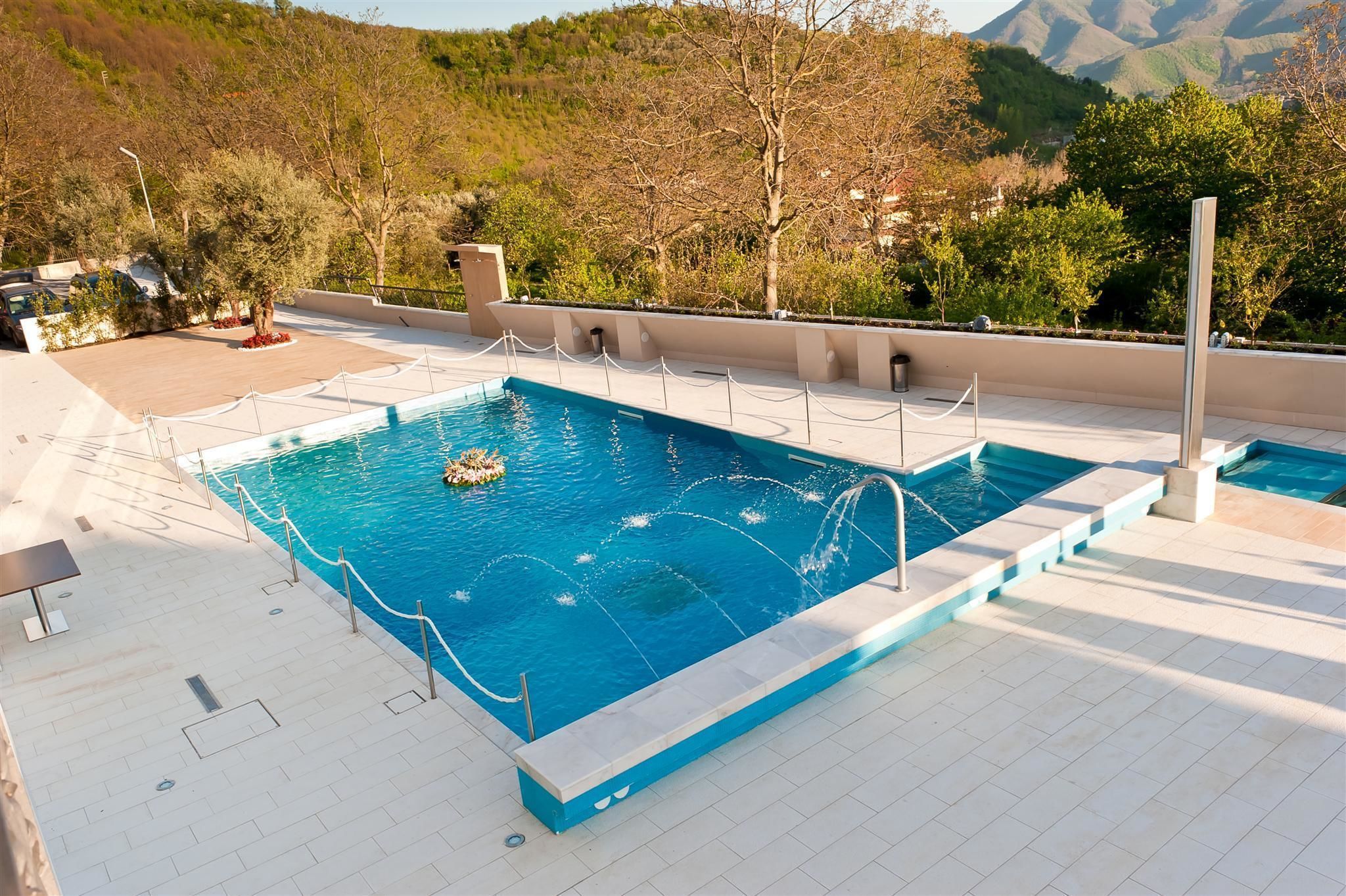 seasonal outdoor pool, open 9:00 am to 7:00 pm, pool umbrellas