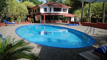 Outdoor pool, open 7 AM to 10 PM, pool loungers