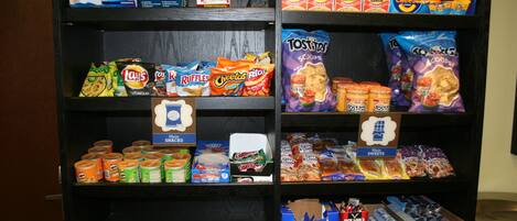 A snack display with various brands and types of snacks.