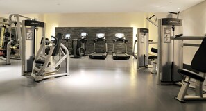 Stay fit on the go with our well-equipped gym featuring treadmills, ellipticals, and weight machines.