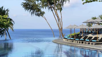 2 outdoor pools, open 7:00 AM to 7:00 PM, pool umbrellas, pool loungers