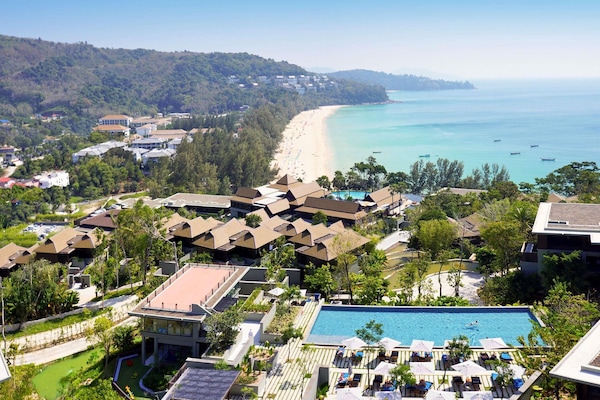 2 outdoor pools, open 7:00 AM to 7:00 PM, pool umbrellas, pool loungers