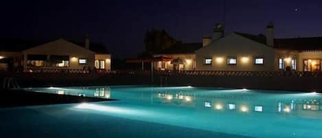 Seasonal outdoor pool, open 9:00 AM to 9:00 PM, pool loungers