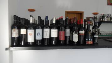 A row of wine bottles on a counter.