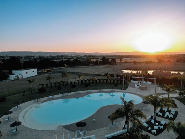 Seasonal outdoor pool, pool umbrellas, sun loungers