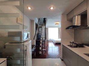 Grand Duplex, Bathtub, City View | In-room safe, desk, blackout drapes, iron/ironing board - World Union Service Apartment Cosmo (Shanghai)