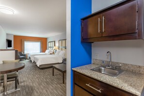 A hotel room with two beds, a desk, and a kitchenette with a sink. - Holiday Inn Express Hotel & Suites Albert Lea - I-35 by IHG (Albert Lea)
