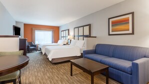 A hotel room with a bed, a sofa, a desk, and a chair. - Holiday Inn Express Hotel & Suites Albert Lea - I-35 by IHG (Albert Lea)