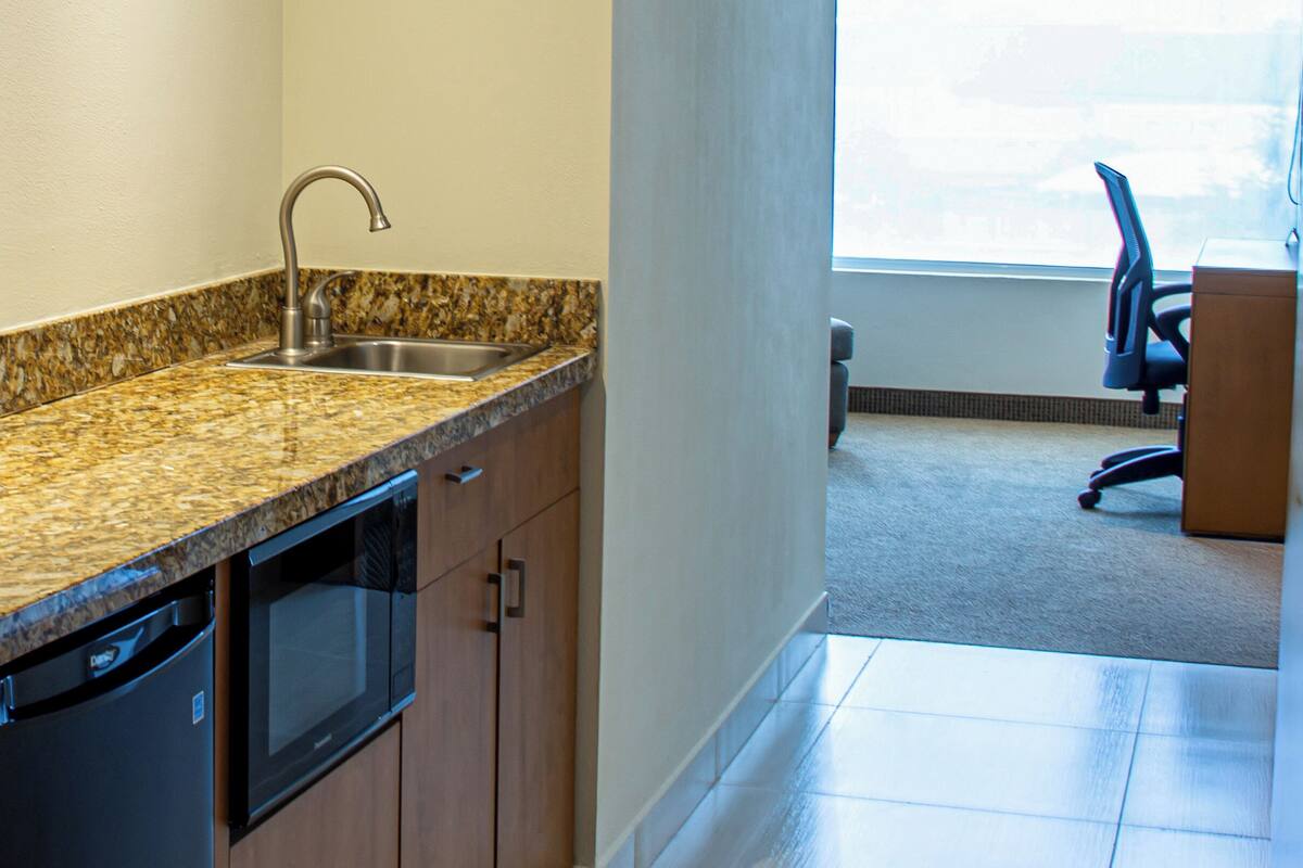 Junior Suite, 1 Queen Bed | Private kitchen | Coffee/tea maker, shared microwave