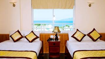 Deluxe Double or Twin Room, Sea View | Minibar, in-room safe, desk, blackout drapes
