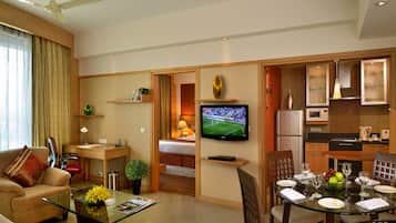 Suite, 1 Bedroom | Living room | 32-inch LCD TV with satellite channels, TV