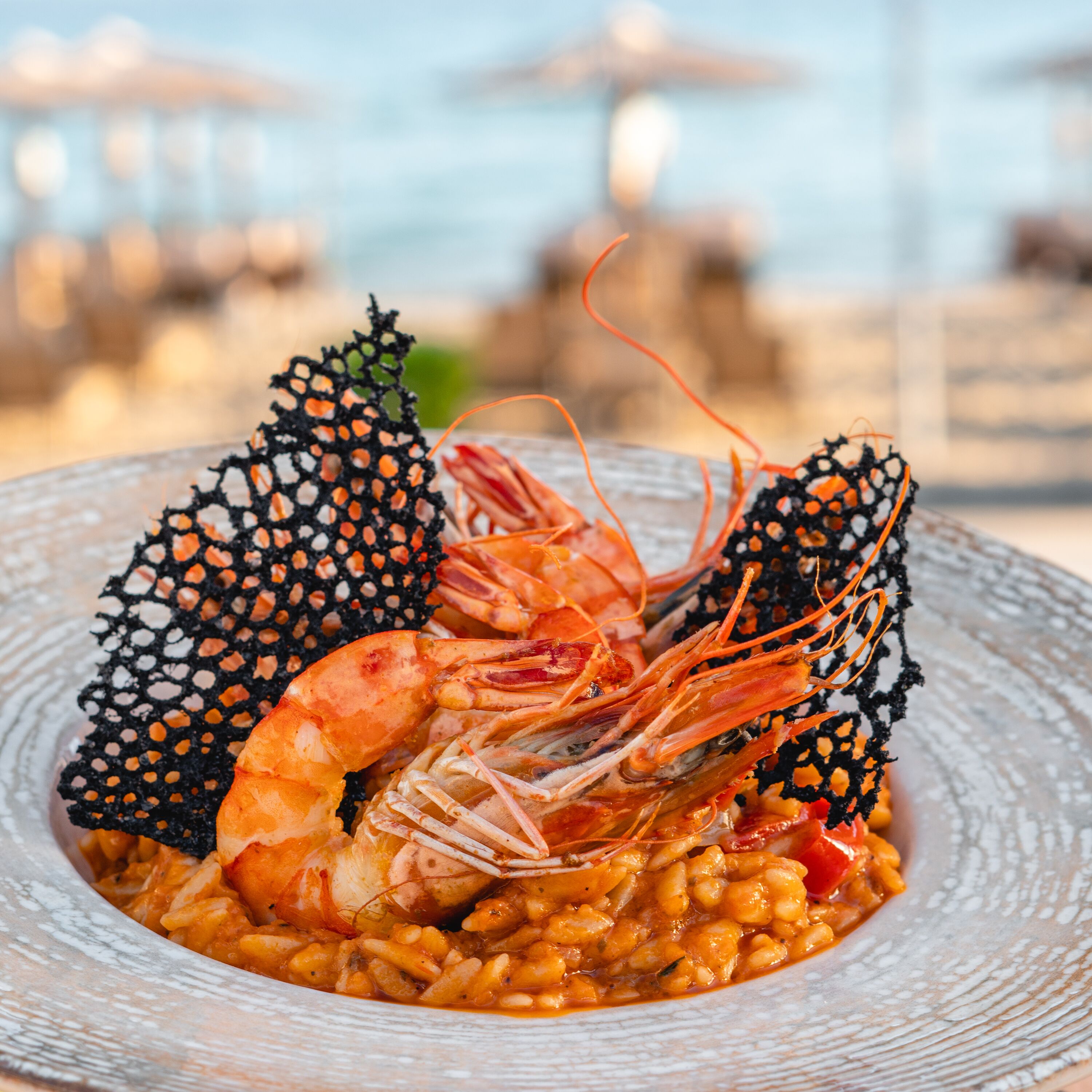 A seafood dish with shrimp and mussels on a plate.