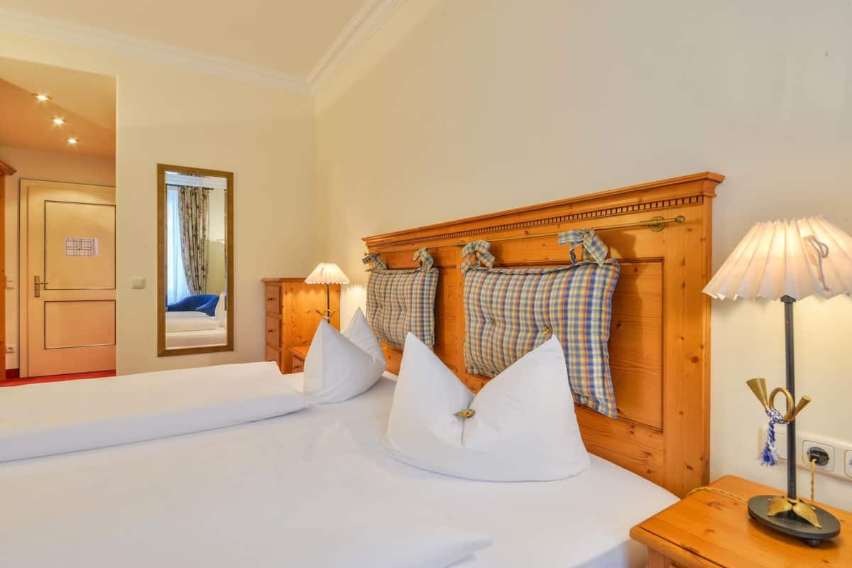 hypo-allergenic bedding, down duvets, in-room safe, desk