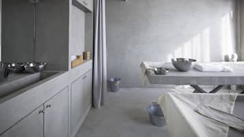 Features a large mirror, sleek vanity, and spacious shower area.