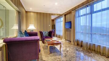 Deluxe Suite, Sea View | Living area | LCD TV