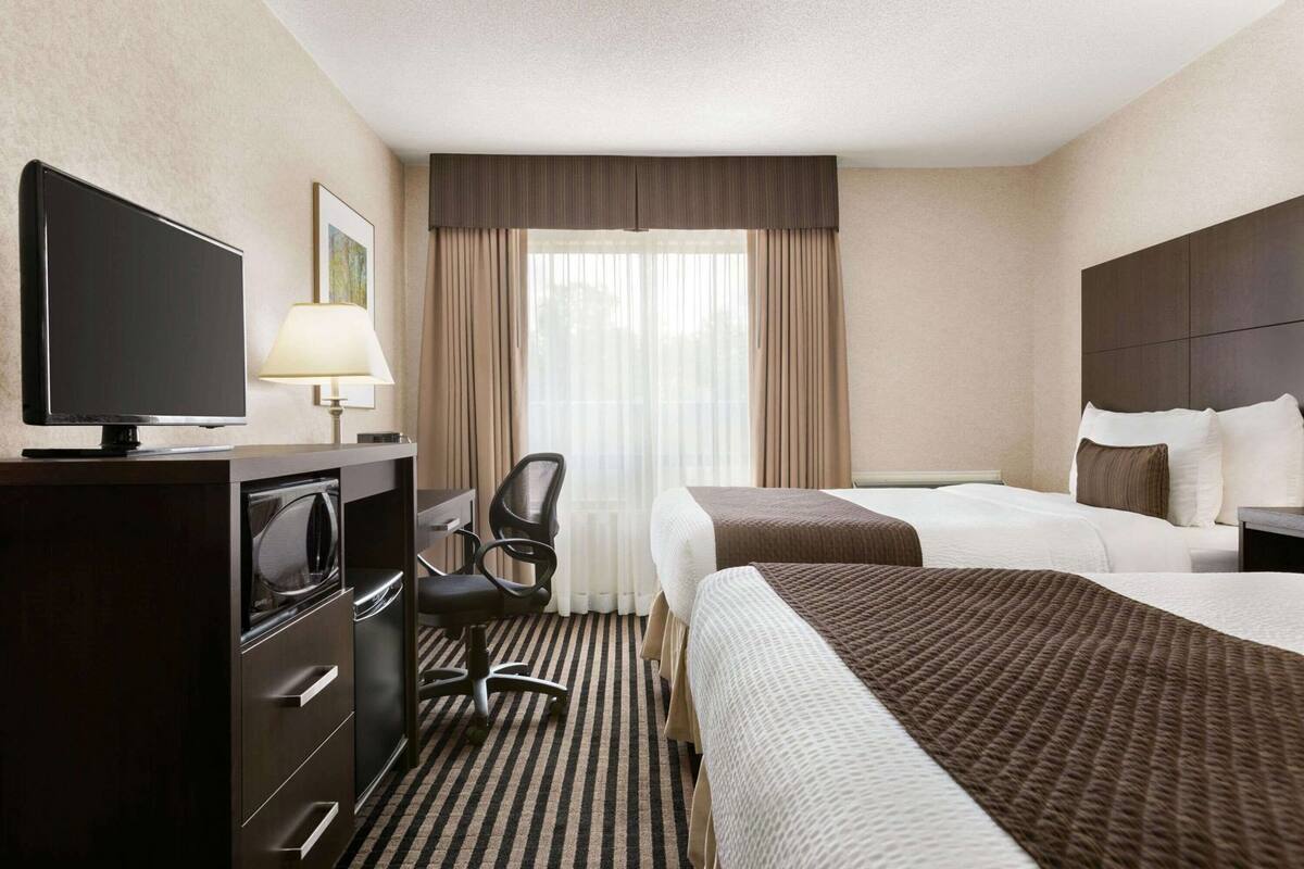 Pillowtop beds, desk, iron/ironing board, rollaway beds