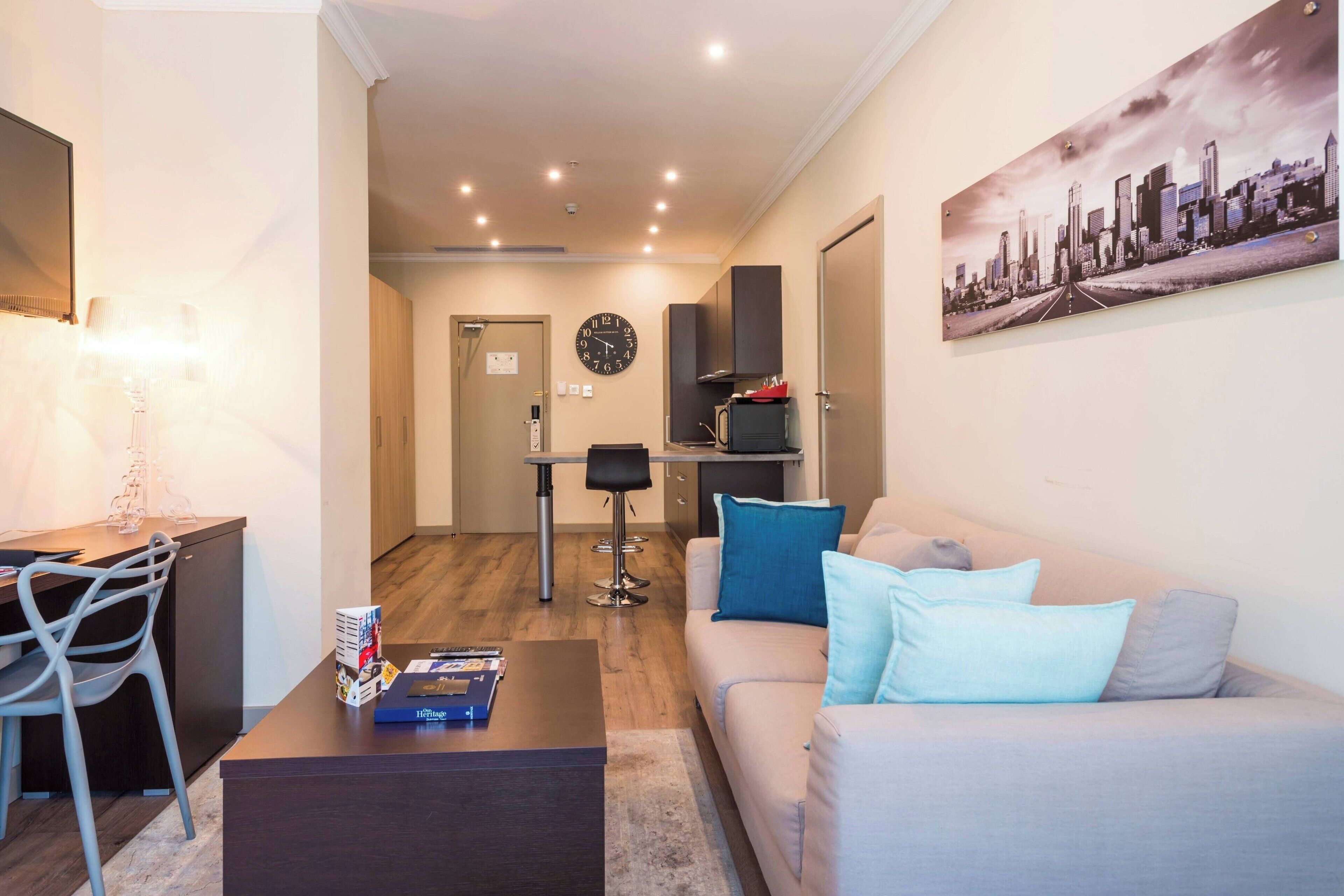 apartment, 1 king bed with sofa bed, non smoking, city view | living area | flat-screen tv