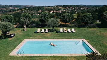Seasonal outdoor pool, pool umbrellas, pool loungers
