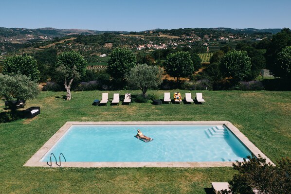 Seasonal outdoor pool, pool umbrellas, pool loungers