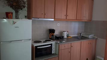 Apartment, 1 Bedroom, Balcony | Private kitchenette | Full-sized fridge, oven, stovetop, coffee/tea maker