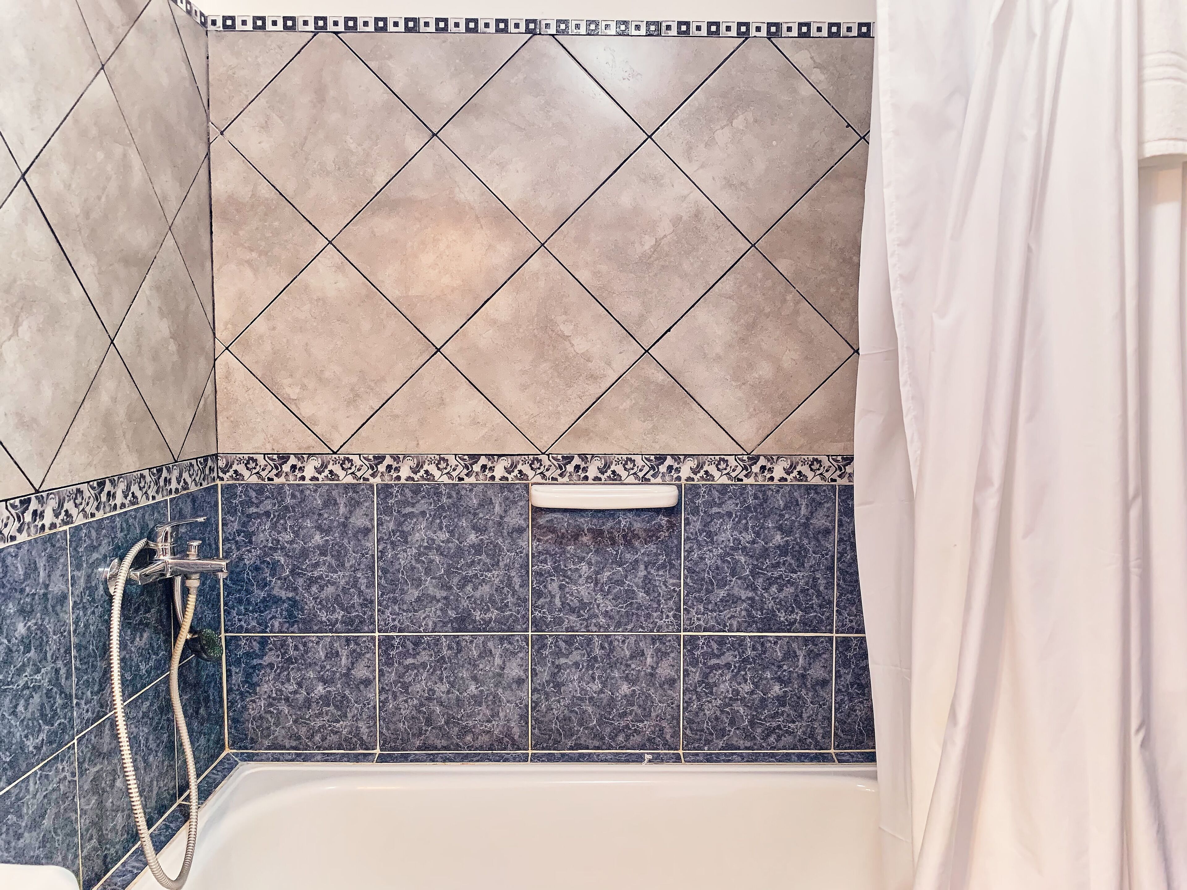 family room, 2 bedrooms, hill view | bathroom shower