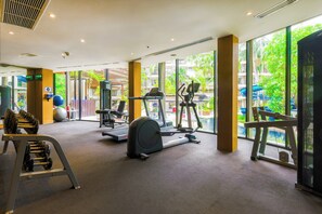 A gym with treadmills, elliptical machines, and weight benches. - Holiday Inn Resort Phuket Surin Beach by IHG (Choeng Thale)