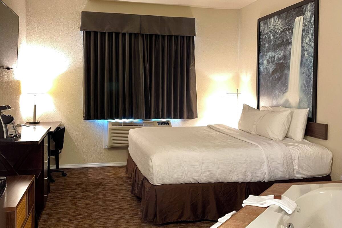 pillow-top beds, desk, laptop workspace, blackout curtains