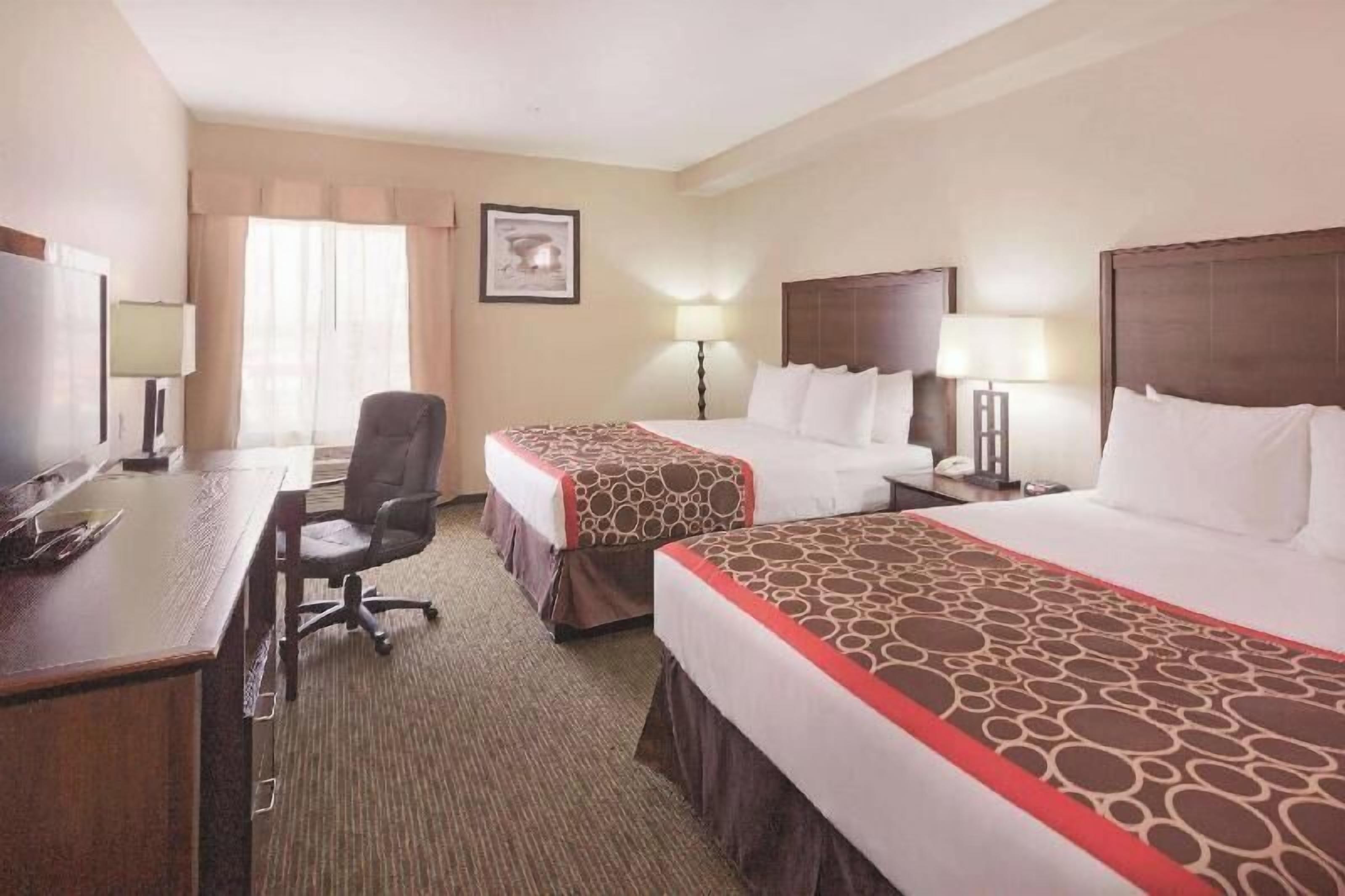 Premium bedding, pillowtop beds, desk, laptop workspace