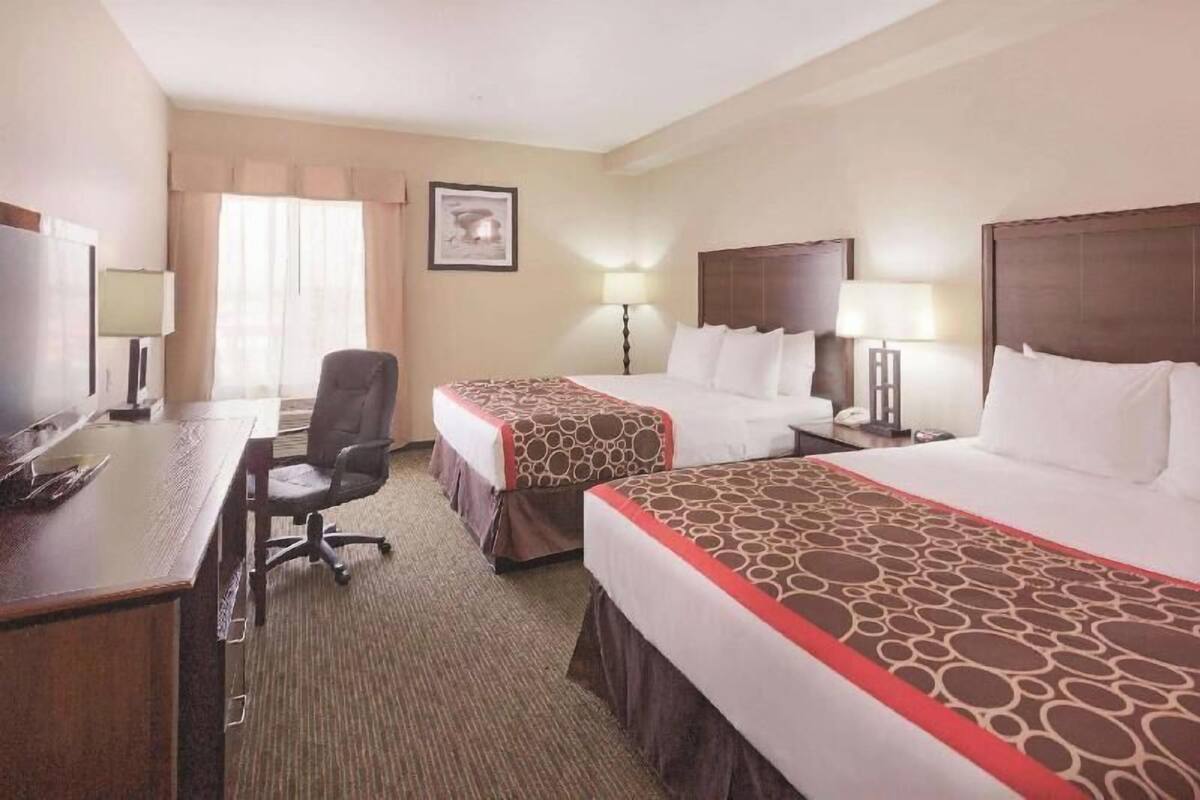 Premium bedding, pillowtop beds, desk, laptop workspace