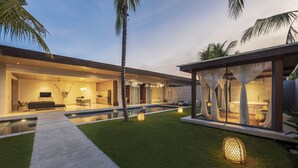 A modern house with a swimming pool, outdoor seating, and a glass-enclosed spa area. - One Eleven Retreat (Keroboken Kelod)