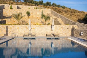 Seasonal outdoor pool, open 9:00 AM to 9:00 PM, pool umbrellas