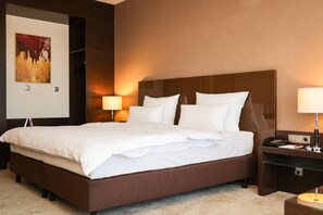 Hypo-allergenic bedding, pillow-top beds, in-room safe