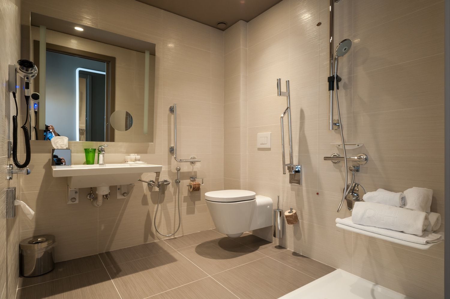 comfort room (accessible for disabled) | bathroom | shower, rainfall showerhead, designer toiletries, hair dryer