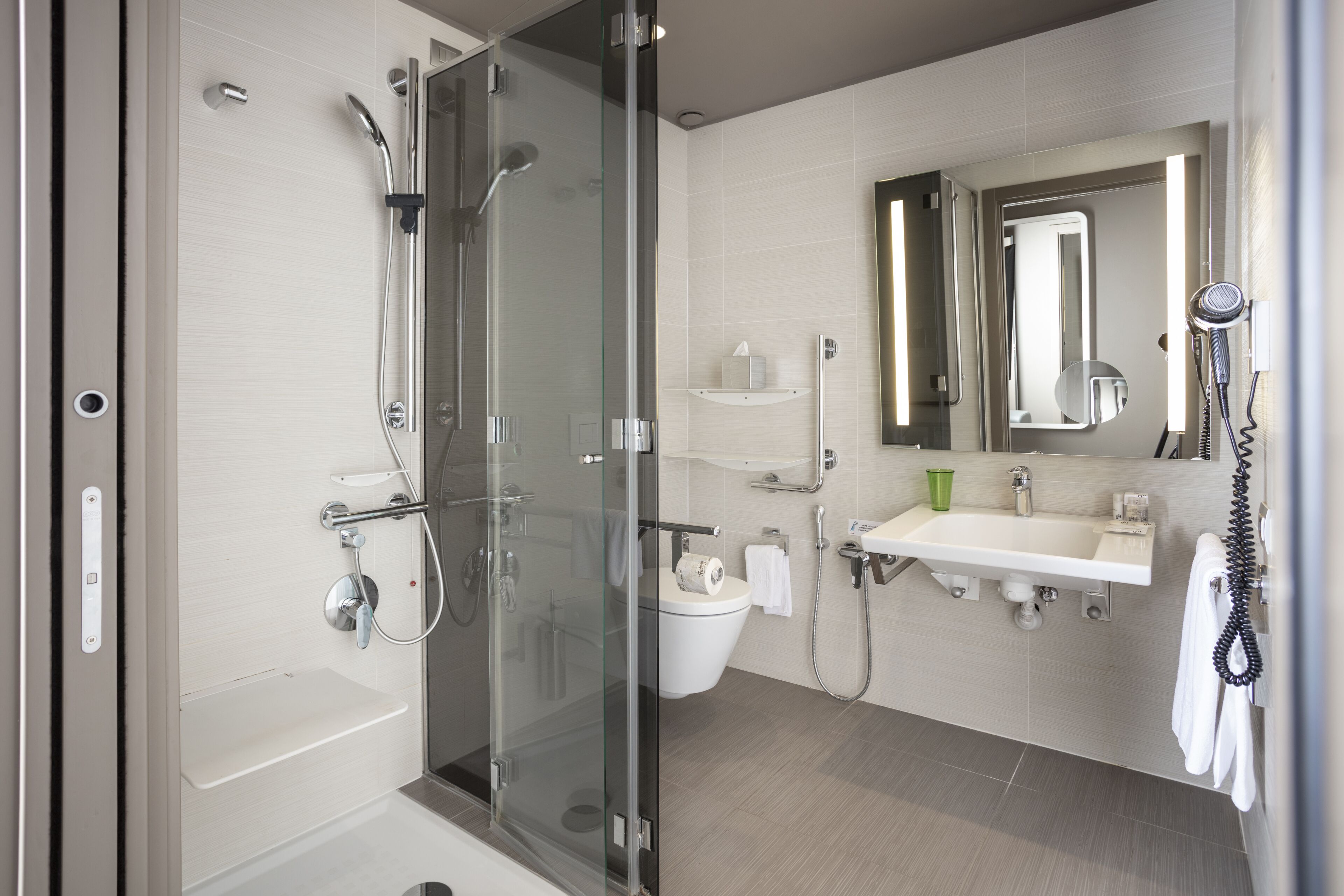 comfort room (accessible for disabled) | bathroom | shower, rainfall showerhead, designer toiletries, hair dryer