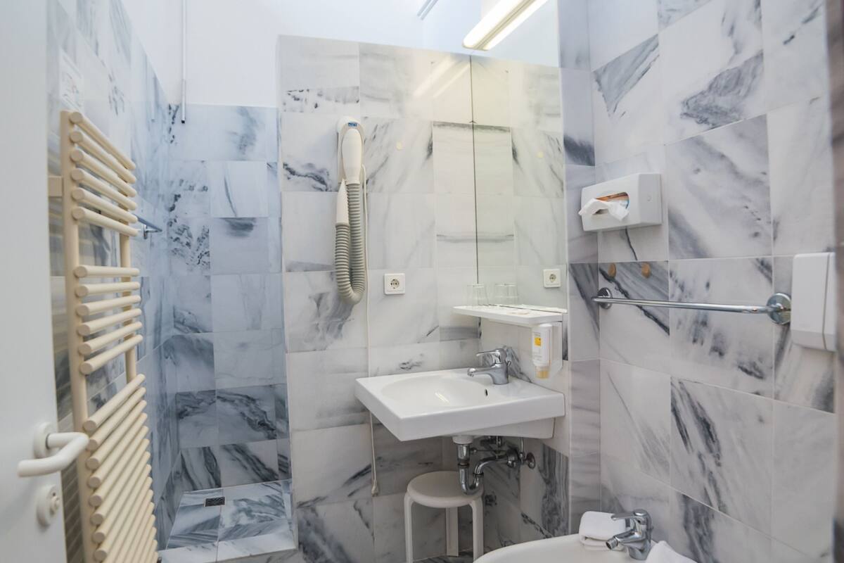 standard double or twin room | bathroom | rainfall showerhead, free toiletries, hair dryer, bidet