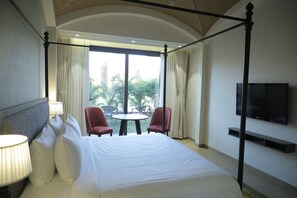 In-room safe, desk, laptop workspace, iron/ironing board - Radisson Resort & Spa Kandla (Gandhidham)