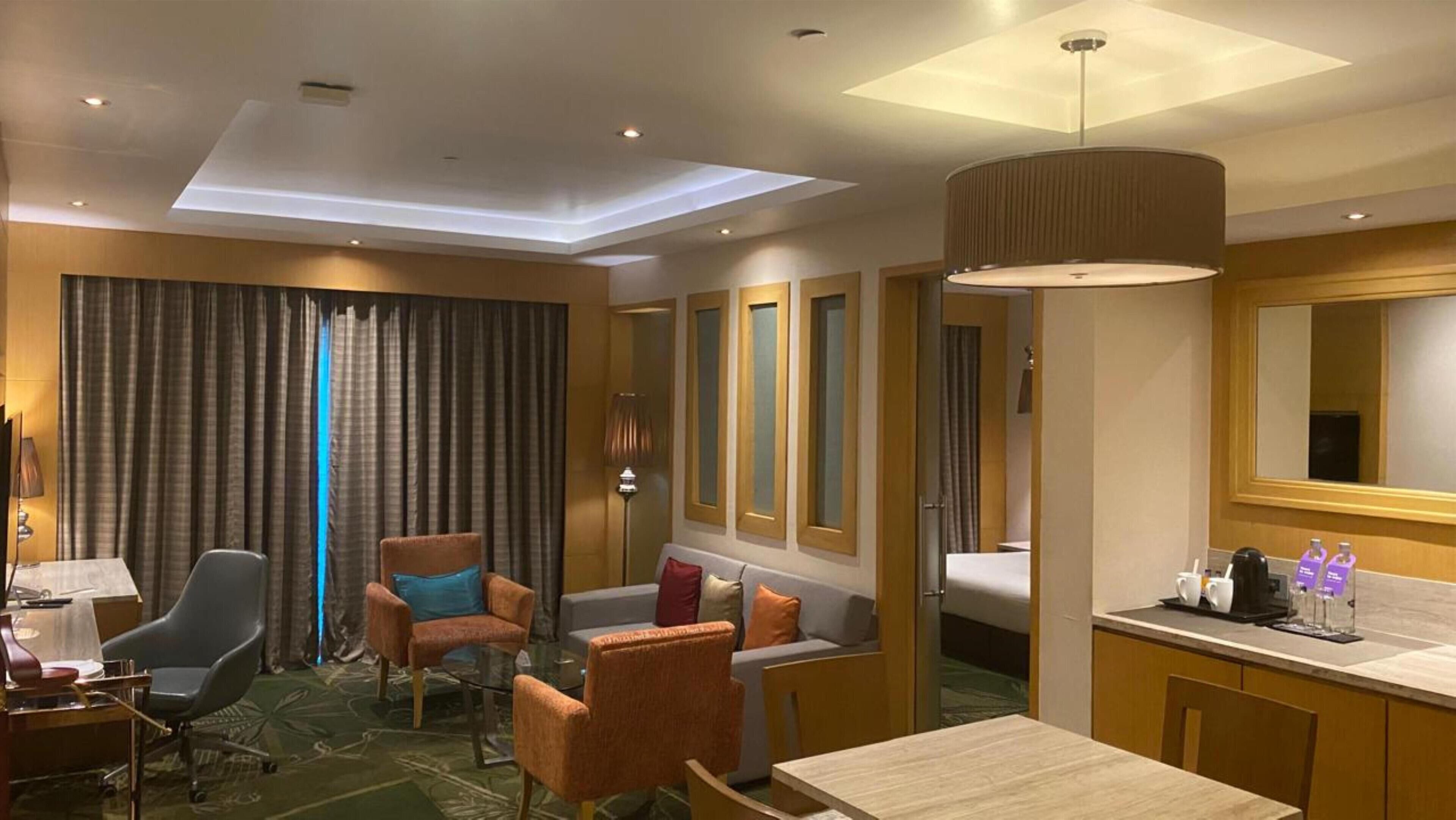 Luxury Suite, 1 Bedroom | In-room safe, desk, laptop workspace, iron/ironing board