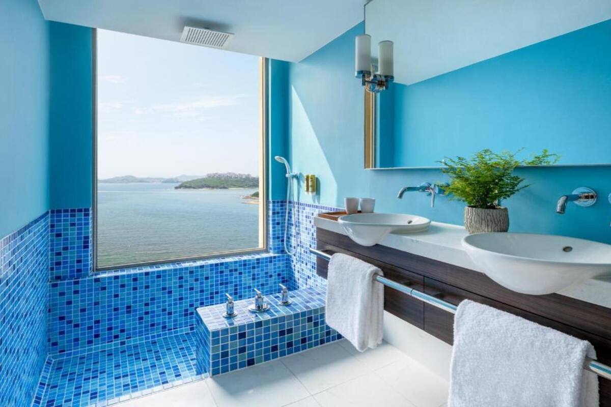 shower, hair dryer, bathrobes, slippers