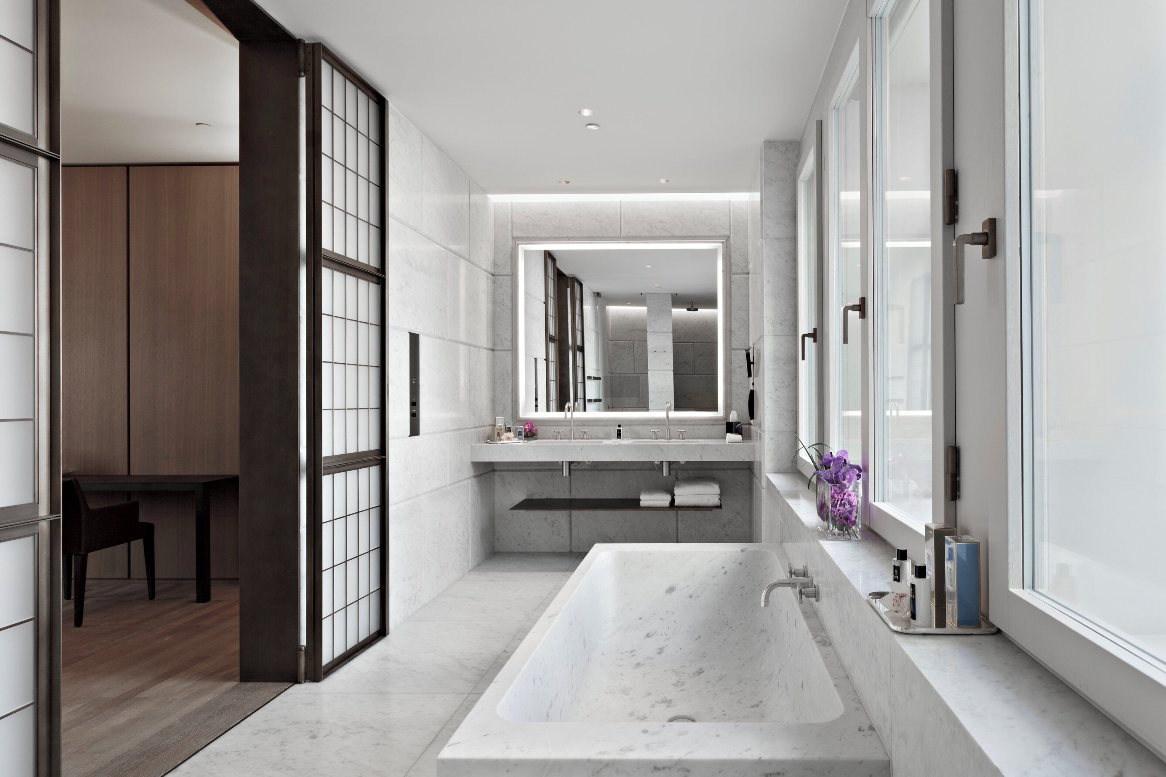 designer toiletries, hair dryer, bathrobes, slippers