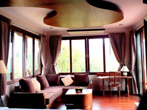 Deluxe Room | Living area | Flat-screen TV - Bura Resort, Chiang Rai (Chiang Rai)