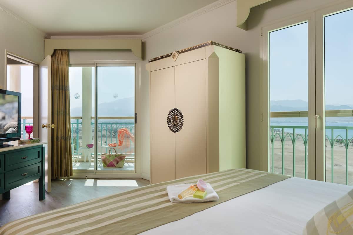 junior suite, balcony, lagoon view | minibar, in-room safe, desk, blackout curtains