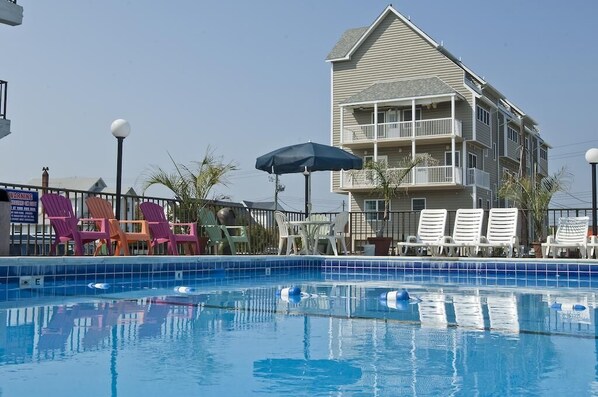 Seasonal outdoor pool, pool umbrellas, pool loungers