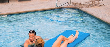 Seasonal outdoor pool, open 8:00 AM to 9:00 PM, pool umbrellas
