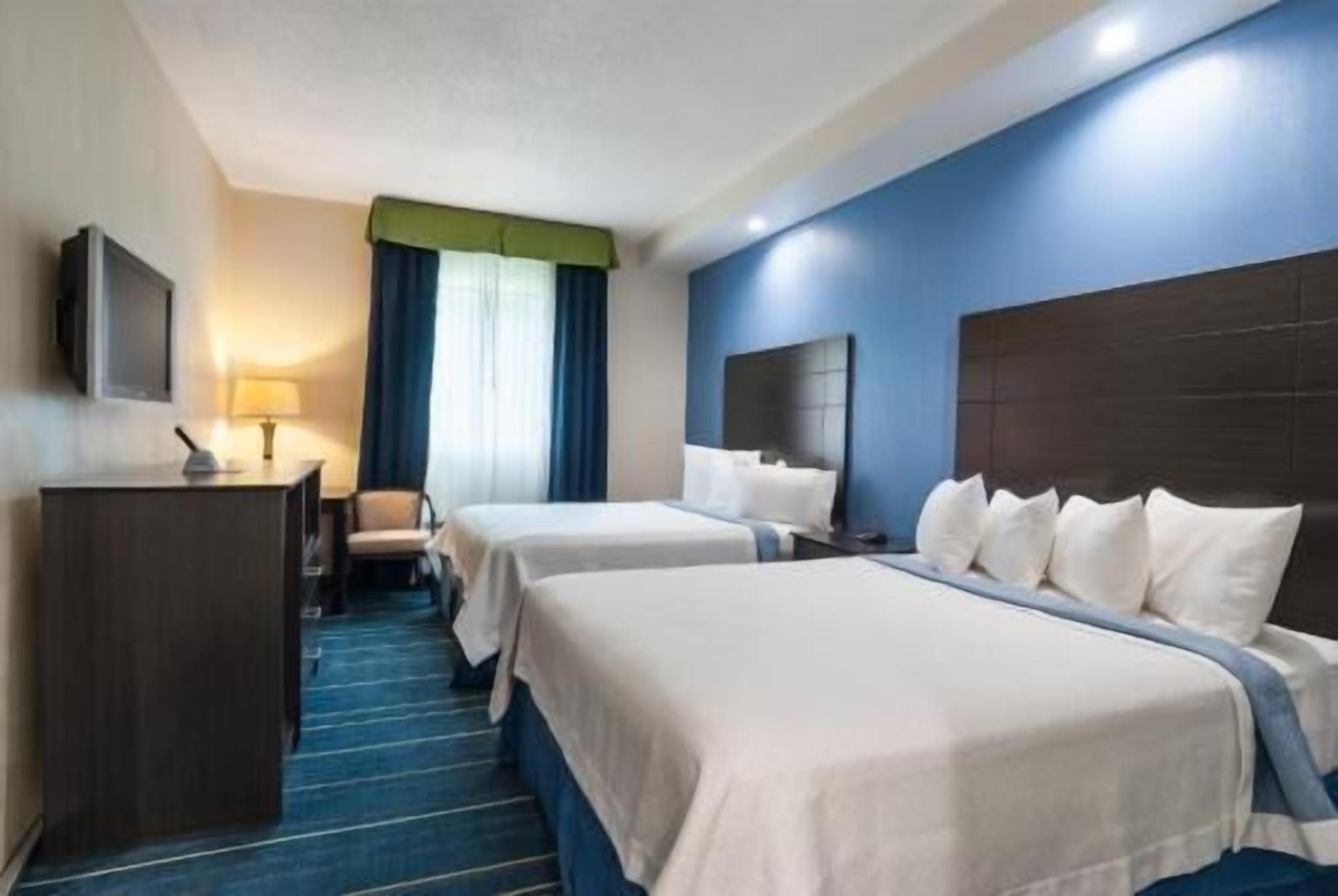Premium bedding, down duvets, desk, laptop workspace