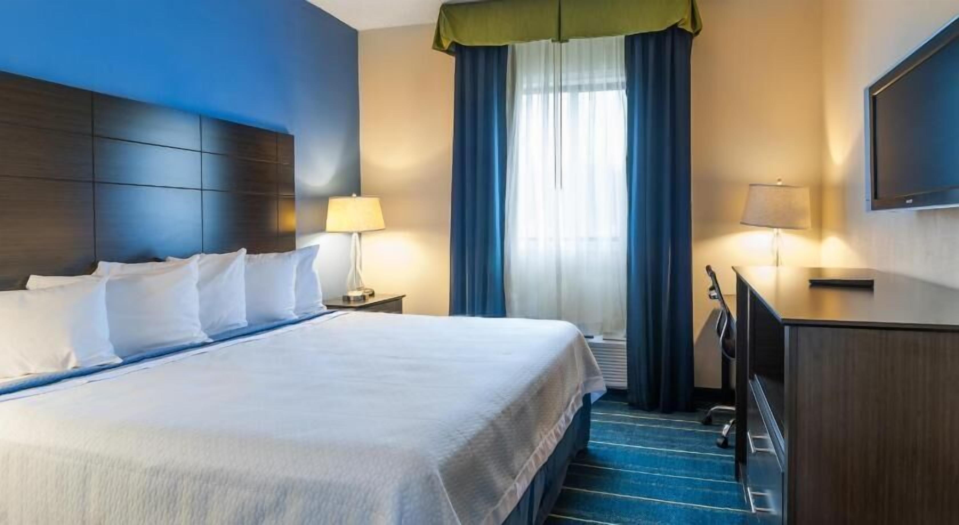 Premium bedding, down duvets, desk, laptop workspace