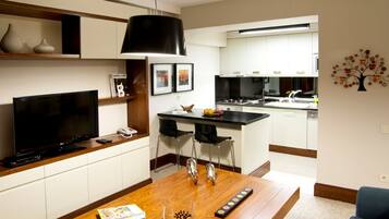 Executive Suite | Living room | 108-inch plasma TV with satellite channels, TV, DVD player