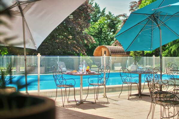 Seasonal outdoor pool, pool umbrellas, pool loungers