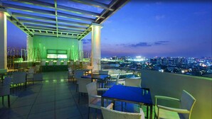 A rooftop bar with outdoor seating, a city view, and a modern design. - Daspalla Hyderabad (Hyderabad)