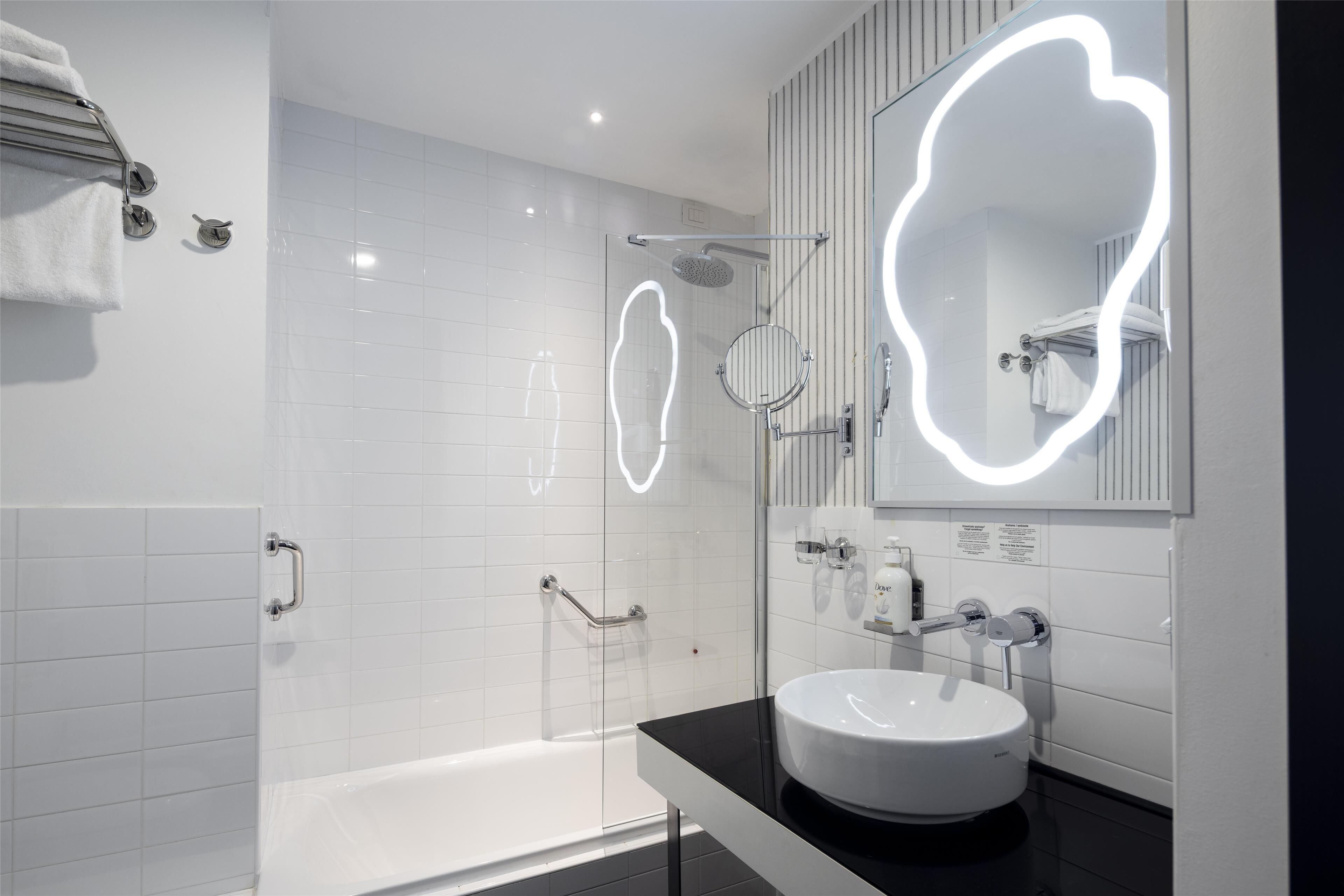 combined shower/bathtub, free toiletries, hair dryer, bathrobes